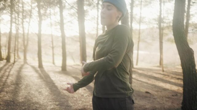 Talented hip hop woman freestyling and beatboxing in the forest