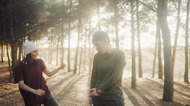Friends freestyling hip hop and beatboxing in a sunlit forest