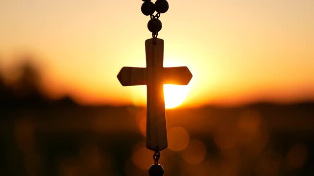 Religious cross at sunset