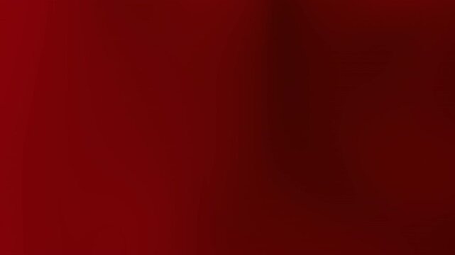 A close-up shot of a red fabric background with subtle texture and gradient effects