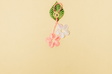 One beautiful floral martisor on a soft yellow background.