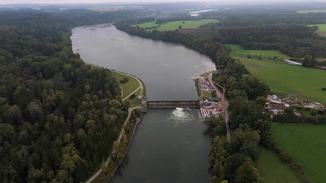 Birds-eye view of Lech River with Lechstaustufe 15 reconstruction. Stauwehr and fish ladders protect migratory fish. Luftaufnahme der Lechstaustufe 15 in Landsberg am Lech