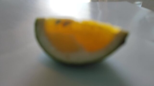 Blur Fresh orange slice showing juicy texture and vibrant citrus color, perfect for healthy food and nutrition concepts.