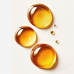 Honey drops close-up on white background. Health & beauty product ingredient