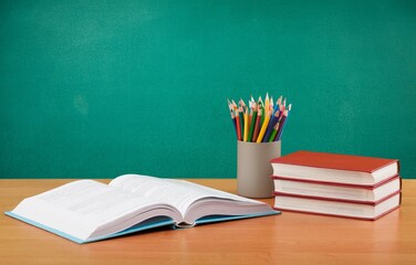 Back to school concept. Colorful stationery and books on desk © BillionPhotos.com