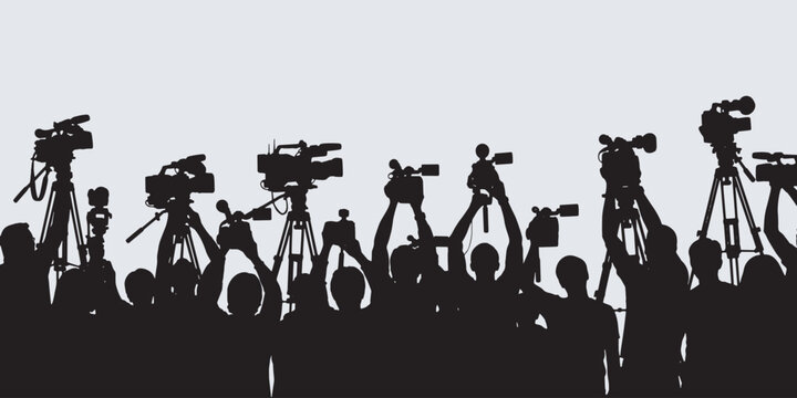 Silhouette of a crowd holding up cameras and video equipment at an event or press conference.