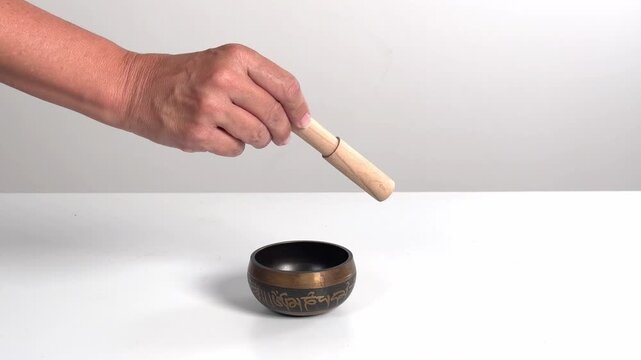 Video with real sound effect of Metal tibetan singing bowl tap.