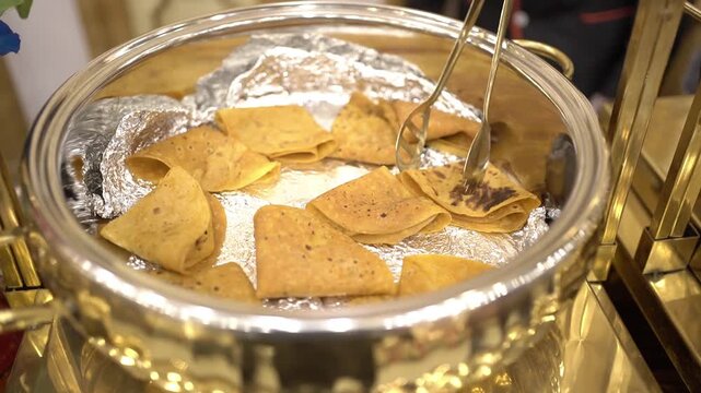Plain fulka prepared in Marwari style in a wedding in India