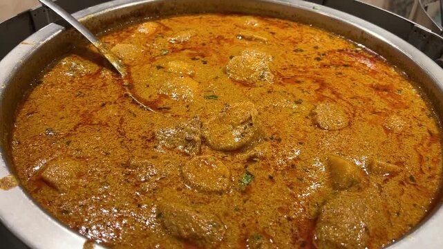 Spicy Aloo Dum prepared in Bengali style