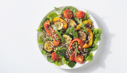 Plate of quinoa salad with fresh vegetables. Healthy food concept. Perfect for food blog, healthy eating website, or cooking magazine.