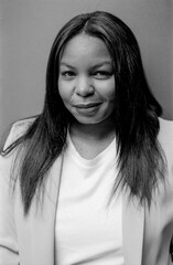 Confident businesswoman smiling in monochrome analog portrait