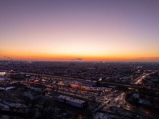 Naklejka premium Sunset with clouds overlooking urban city and Nuclear plant in the background