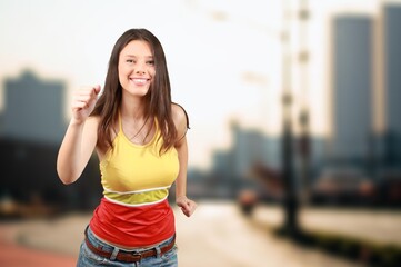 pretty young smiling woman sport exercises in morning park