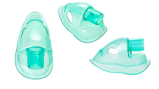 three distinct views of a clear plastic nebulizer mask with a turquoise tint, designed for medical respiratory therapy and aerosol drug delivery, isolated on a transparent background.