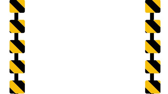 Two vertical caution pillars with yellow and black stripes stand as markers for a narrow gateway