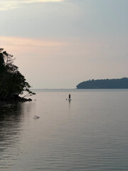 A panorama view of a sunset over the ocean off the coast of Cambodia at the island of Koh Russey (Bamboo Island)
