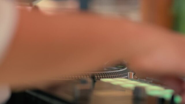 DJ playing on vinyl record on the record player