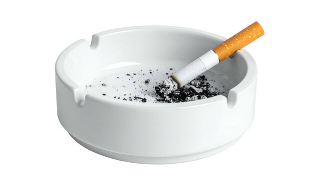 A white ceramic ashtray filled with ash and a lit cigarette