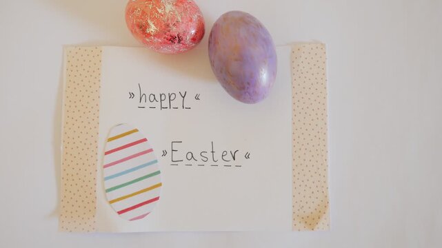 Happy Easter Greeting Card with Colorful Eggs Flat Lay