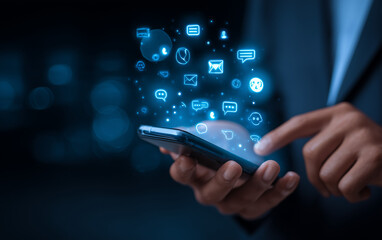 a businessman uses a mobile phone with an ai chatbot concept for customer service and support on a dark background.