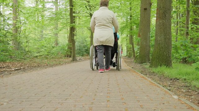 Wheelchair Users Outdoors Near Cafe in City