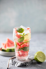 Fresh watermelon mojito or lemonade  with mint and lime in drinking glass on the table © murziknata