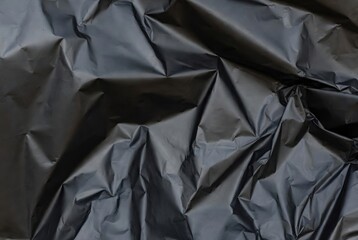 Obraz premium Abstract black and white plastic texture, crumpled glossy plastic wrap