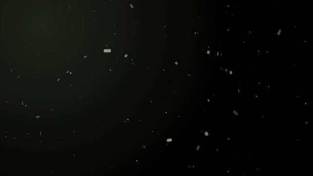 Slow motion organic dust particles floating and shimmering in the air with soft light rays creating abstract motion