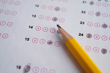 Answer sheets with pencil drawing fill to select choice, education concept.