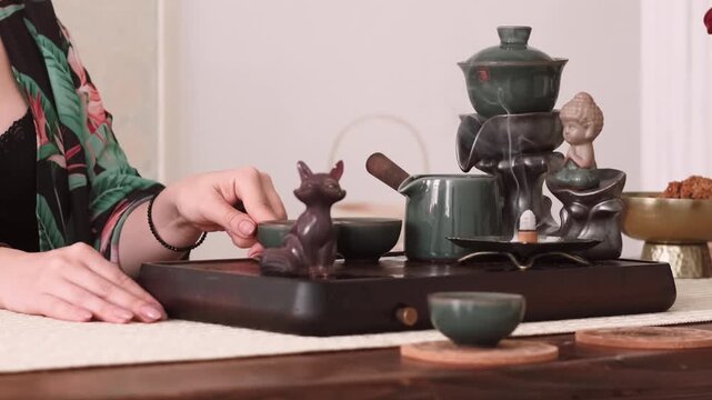 Oriental beverage. Tea ritual. Female hand preparing chinese ceremony enjoying oolong meditation aromatherapy vapor spiritual enlightenment.