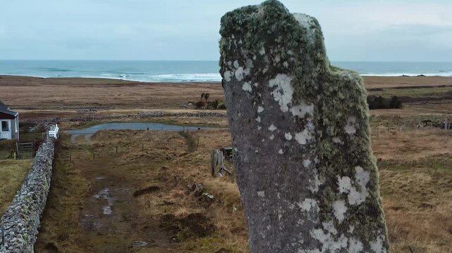 Close up drone shot moving along Clach an Trushal standing stone on Lewis.