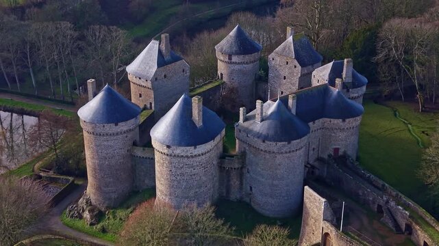 Historic medieval fortified castle with its eight round towers in Lassay-les-Ch&acirc;teaux, Mayenne in France. Aerial drone circling