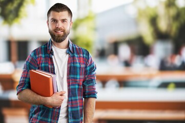 individual portrait of student young man at university campus.