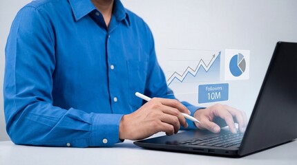 Person in blue shirt using laptop and stylus analyzing business growth charts and social media followers data
