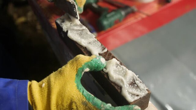 Applying thickened epoxy to wood for boat oarlock