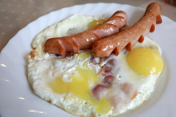 Hot breakfast with two sausages and fried egg