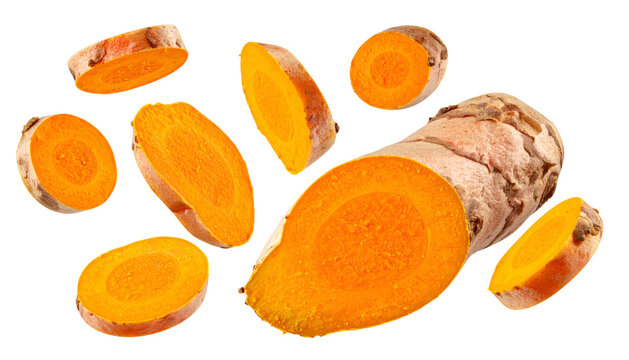 Sliced and whole rhizomes with vibrant orange flesh and golden outer skin
