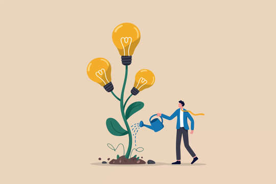 Businessman watering a plant with light bulbs as flowers representing growth of ideas.