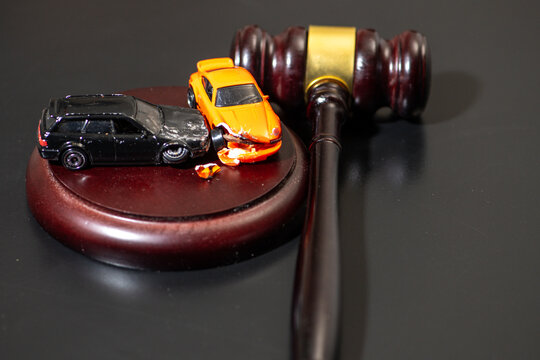 Gavel in traffic court for confiscation and repossession. Car in traffic court for foreclosure bankruptcy and purchase. Gavel for fine and penalty in traffic court. Car for claim insurance.