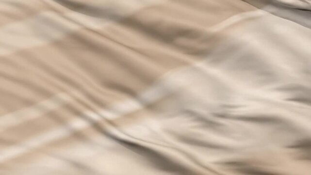 Close-up view of flowing fabric texture in motion, captured in a dynamic video, showcasing abstract patterns and soft folds