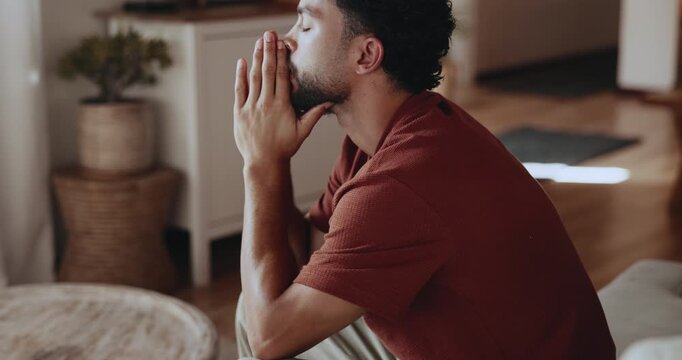 Frustrated, thinking and man with stress in home, overwhelmed and disappointment for financial crisis. Poor money management, reflection and person with regret for finance planning, bankrupt and sad