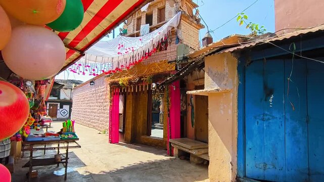 Balaji Temple entrance with street and Local Shops at kodangal, tandur, india. day time, stable shot, 4k.