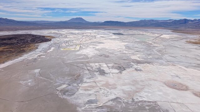 High-altitude salt flat with unique mining patterns in serene Peru landscape