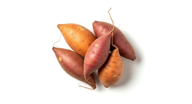 Pile of five sweet potatoes with varied skin color and rootlets on a white background