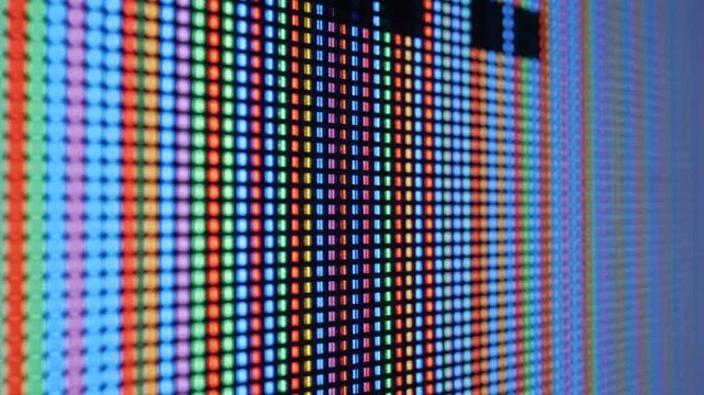 Close up view of an electronic screen with colorful pixels display