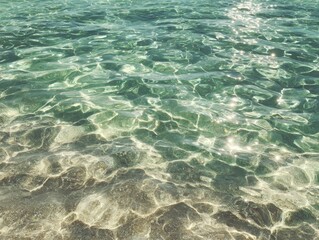 Turquoise water surface reflecting sunlight creating abstract patterns