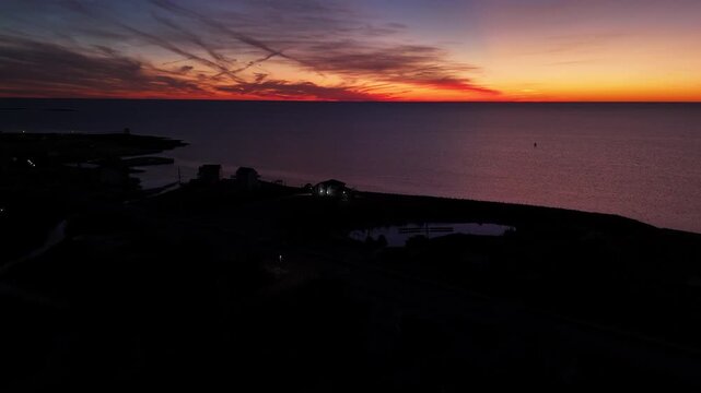Outer Banks Pamlico Sound Sunset over Hatteras Island North Carolina - Aerial 4K