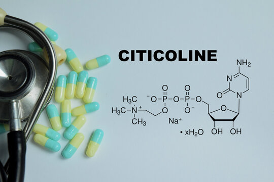 Concept of citicoline cognitive support medication write on book with isolated on Wooden Table. For brain health memory function and neurological treatment