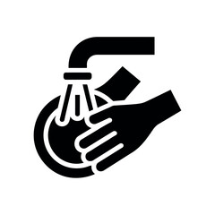 A hand washing under a faucet with soap and water