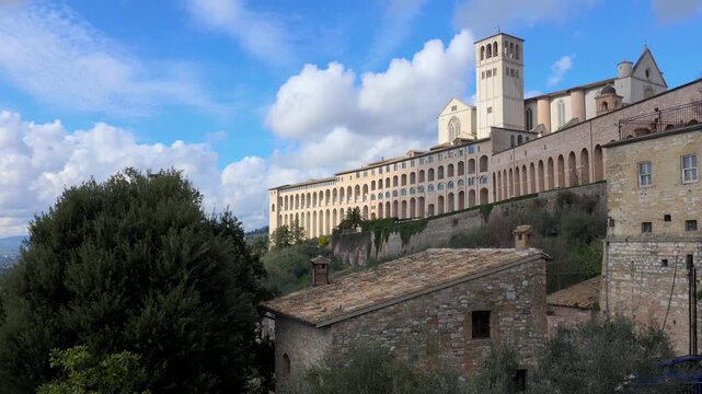Panoramic skyline of the Basilica of Saint Francis in Assisi in winter season, Umbria region, Italy
